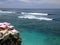 The view of surfing waves from the cliff of Uluwatu, Bali, Indonesia