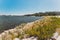 View of the Swan River and Perth skyline and coastline as seen from a pedestrian and bike track next to the city CBD