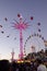 The view of Swing ride tower and Ferris wheel at Sydney Royal Easter show in twilight time.