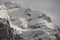 View of the Swiss mountains in winter. Mittelhornin clouds, Schreckhorn and Wetterhorn. Swiss alps in Switzerland Jungfrauregion