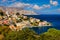 View on Symi Simi island harbor port, classical ship yachts, houses on island hills, Aegean Sea bay. Greece islands holidays