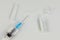 view of syringe with vaccine ampoules