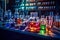 View of table in chemical laboratory full of chemical glass and different colored liquids