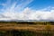 View of the taiga and the endless blue sky from the outskirts of the village