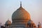 View of the Taj Mahal at sunrise is an ivory-white marble mausoleum