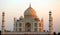 View of the Taj Mahal at sunrise is an ivory-white marble mausoleum