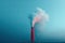 View of a tall chimney with white smoke emission. Pollution of industrial enterprises, exhaust gases of chimneys. Industrial zone