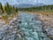 A View of the Tanana River and Beautiful Birch and Pine trees with Mountainous Peaks in the Background after a Light Snow