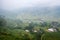 View of Tavan village on rice field terraced with river in foggy