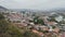 View of Tbilisi from the mountains, houses, the Kura River, ancient churches and the glass bridge of Freedom