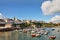 View of Tenby harbour and town on a summers day .