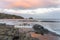 View of Tessellated Pavement at a seashore, in Eaglehawk Neck, Tasmania, Australia at sunset