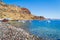 View of Therasia island Korfos pebble beach Greece