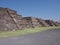View of three stony pyramids at Teotihuacan ruins seen from Avenue of the Dead near Mexico city landscape