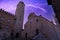 view during a thunderstorm with lightning of the big tower and town hall of the town of san gimignano in tuscany