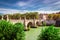 View of the Tiber river in Rome City with bridge crossing the river lined with green trees