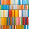 View of a tidy shelf with colorful books. Green, red, blue, orange, pink, white, gray. Portugal