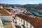 The view of tile roofs of Mertola with bridge across the valley