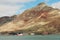 View to the abandoned Russian arctic settlement Pyramiden with the natural mountain in the form of pyramid above, Norway.