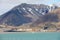 View to the abandoned Russian arctic settlement Pyramiden with the natural mountain in the form of pyramid above, Norway.