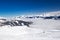 View to Alpine mountains and ski slopes in Austria from famous Kitzbuehel ski resort