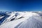 View to Alpine mountains and ski slopes in Austria from Kitzbuehel ski resort.