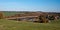 View to Altensalz village with meadow, colorful autumn trees and Pohl water reservoir