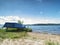 View to anchored laminate blue rowing boat at large lake