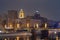 View to the Borodinsky Bridge and Moscow old classical buildings from the embankment of the Moskva River at night