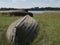 View to the bottom of wooden flipped boats on the ground against blue sky and lake,