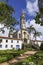 View to church and buildings with blue sky and white clouds, Sanctuary Caraca, Minas Gerais, Brazil