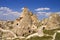 View to cliff dwellings in Cappadocia, Turkey. Ancient cavetown near Goreme