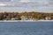 View to coast of New London on a sunny day with old traditional wooden houses at the beach