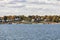 View to coast of New London on a sunny day with old traditional wooden houses at the beach