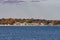 View to coast of New London t on a sunny day with old traditional wooden houses at the beach