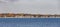 View to coast of New London t on a sunny day with old traditional wooden houses at the beach