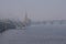 View to the embankment near the river port. City landscape. Kyiv, Ukraine. Misty winter morning