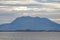 View to GullsvÃ¥gfjellet Mountain on Vega island from the sea in evening haze