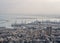 View to the Haifa port in Israel short on a cloudy day. Indusrtial part of Haifa with docks and ferry ships. Buildings of a