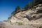 View to the high coast of Baltic sea with pine trees, coastal erosion in Labrags