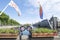 View to the historical Binnenhof with the Hofvijver lake, flags and flowers in foreground, focus on foreground, by day in The