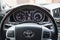 View to the interior of Toyota Land Cruiser 200 with dashboard, clock, media system, front seats, gray leather and shift gear