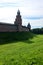 View to Kokui tower and wall of the Velikiy Great Novgorod citadel kremlin, detinets in Russia under blue summer sky in the mo