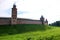 View to Kokui tower and wall of the Velikiy Great Novgorod citadel kremlin, detinets in Russia under blue summer sky in the mo