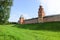 View to Kokui tower and wall of the Velikiy Great Novgorod citadel kremlin, detinets in Russia under blue summer sky in the mo