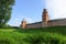 View to Kokui tower and wall of the Velikiy Great Novgorod citadel kremlin, detinets in Russia under blue summer sky in the mo