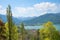 View to lake Tegernsee and castle, alpine spring landscape with green trees, upper bavaria