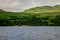 A view to Loch Tay lodges village taken from the rental boat in a lake, central Scotland