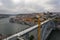 View to the old city of Porto with the D. Luis bridge and construction crane. Cloudy sky