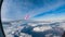 View to porthole during flight high altitude